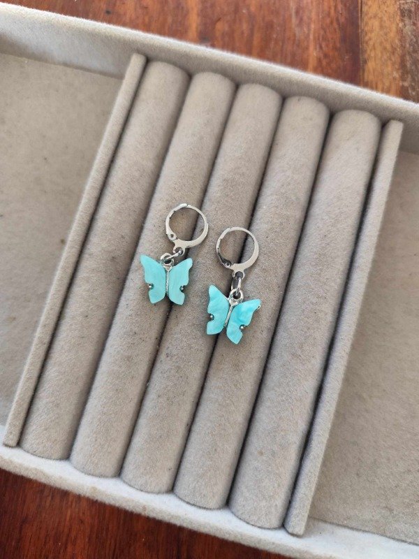 Producto - Aros mariposa aqua colgantes. Acero quirúrgico
