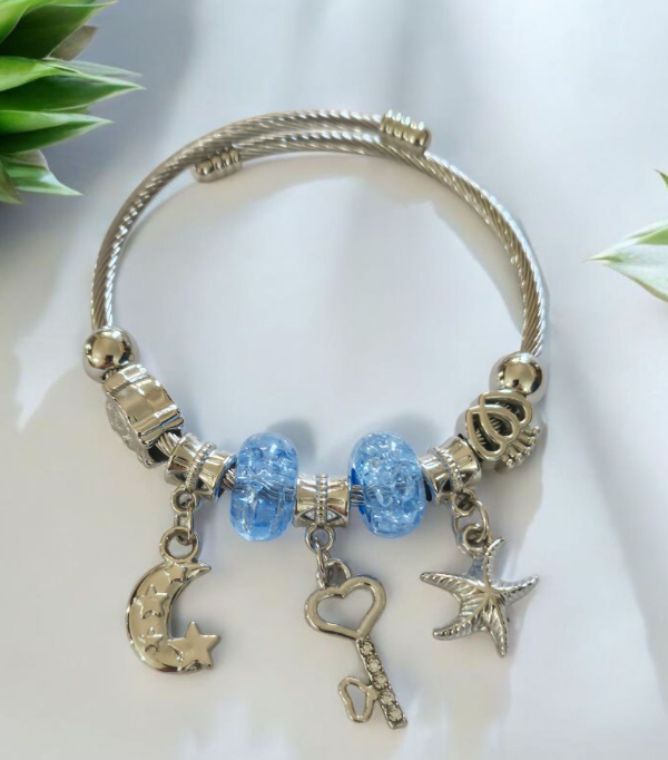 Producto - Pulsera acero donas celeste  llave
