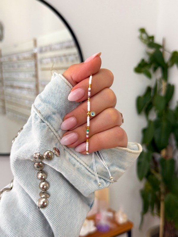 Producto - Pulsera mostacillas blancas ojito celeste