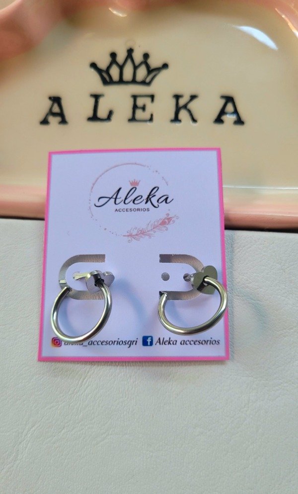 Producto - Argollas con dijes corazones de acero quirúrgico