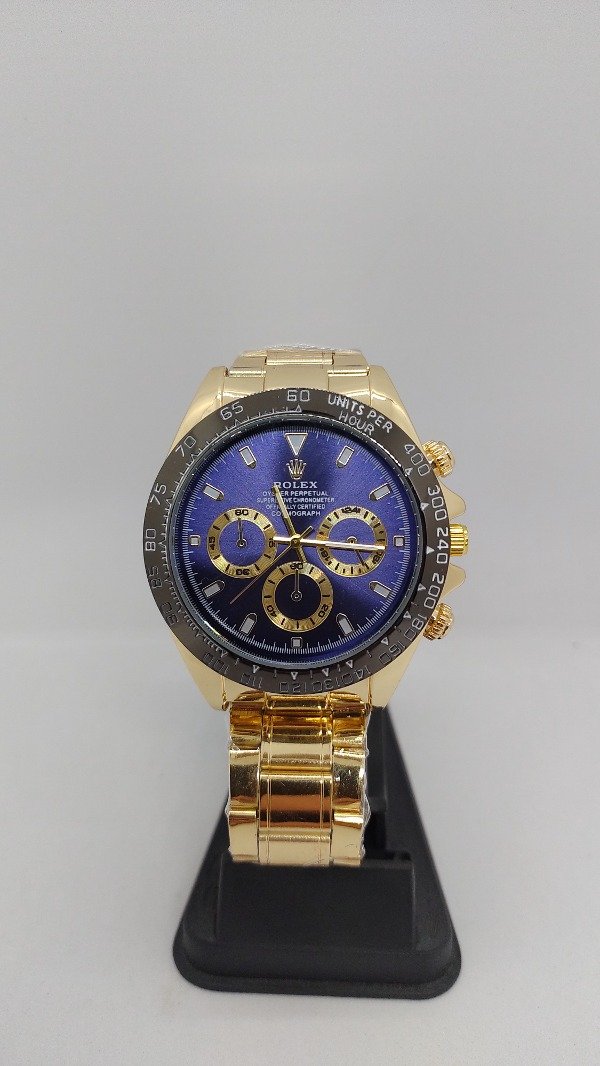 Producto - Reloj Rolex dorado fondo azul