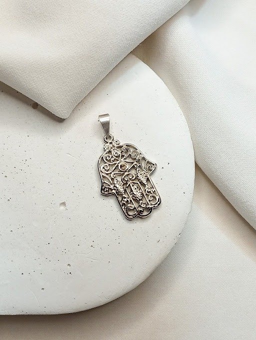 Producto - Dije labrado hamsa - Acero quirúrgico