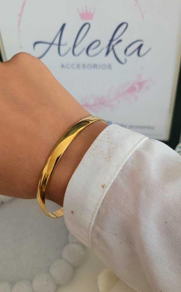 Producto - Esclava lisa gruesa de acero dorado