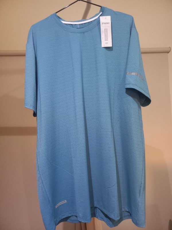 Producto - Remera dry fit Shade petroleo