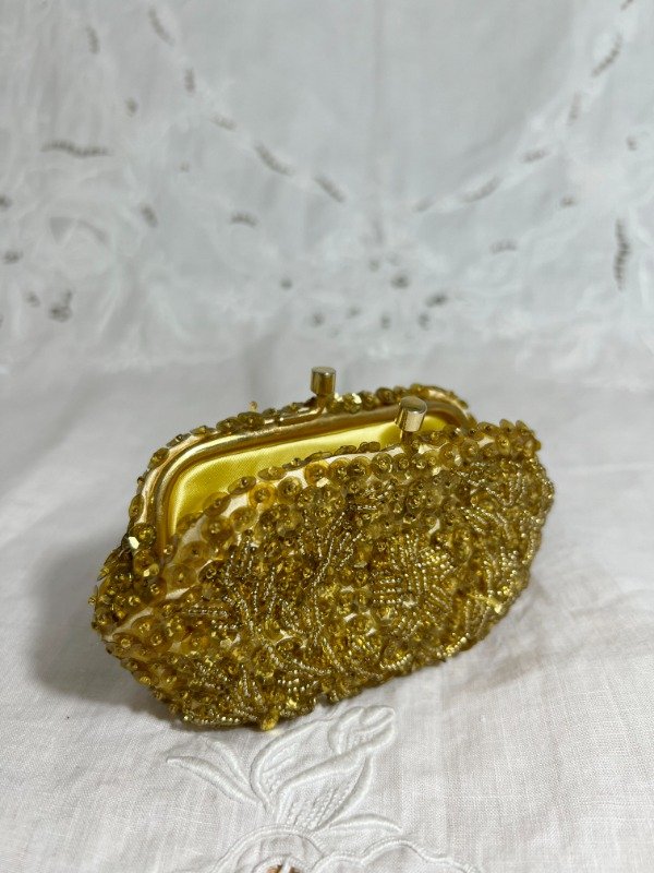 Producto - Monedero dorado