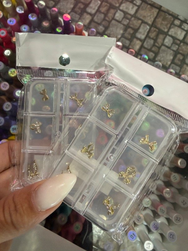 Producto - Dije moños con strass