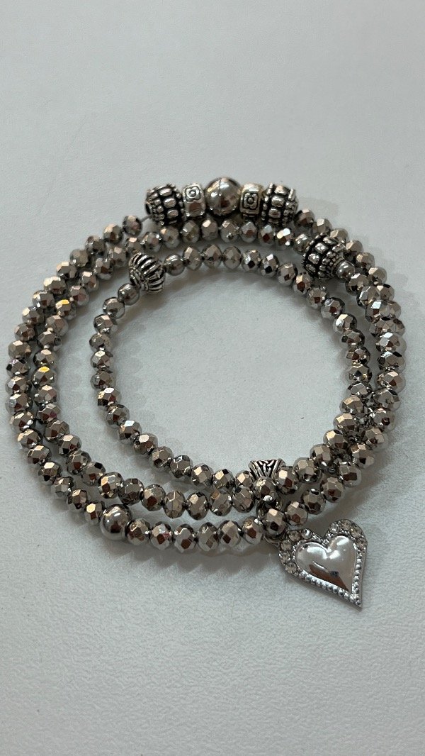 Producto - Pulsera imán plateada.