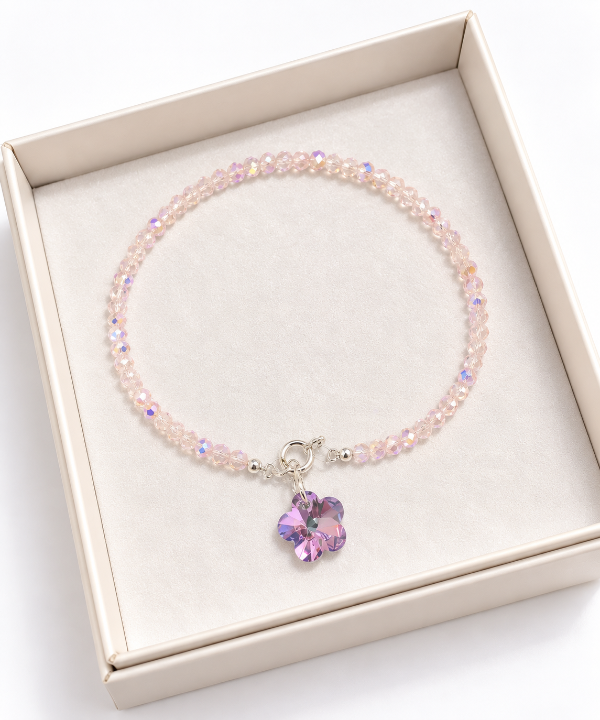 Producto - Pulseras cristal color rosa con dije flor