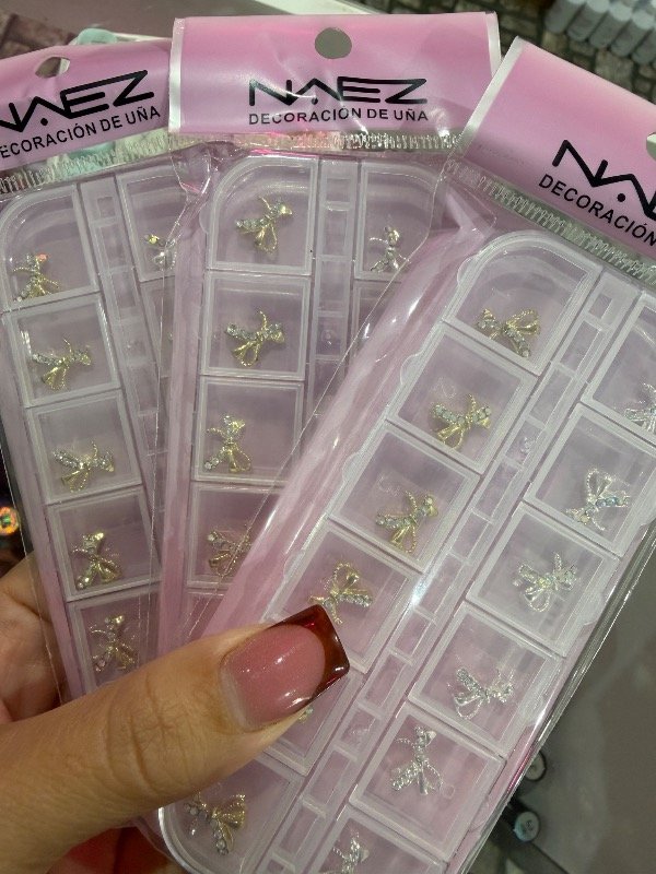 Producto - Dije moños con strass plata y gold