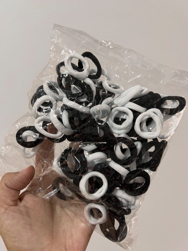 Producto - paquete de colitas colores negras y blancas