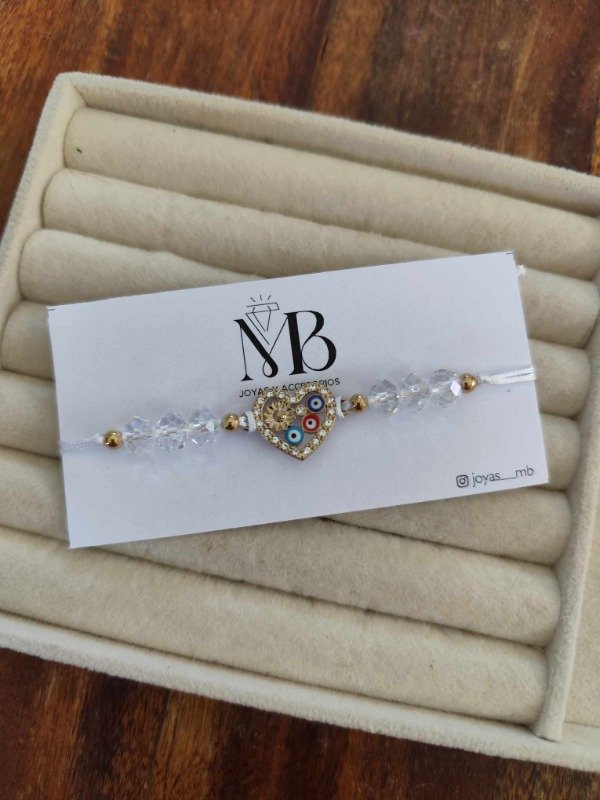 Producto - Pulsera corazones y ojitos blanca.
