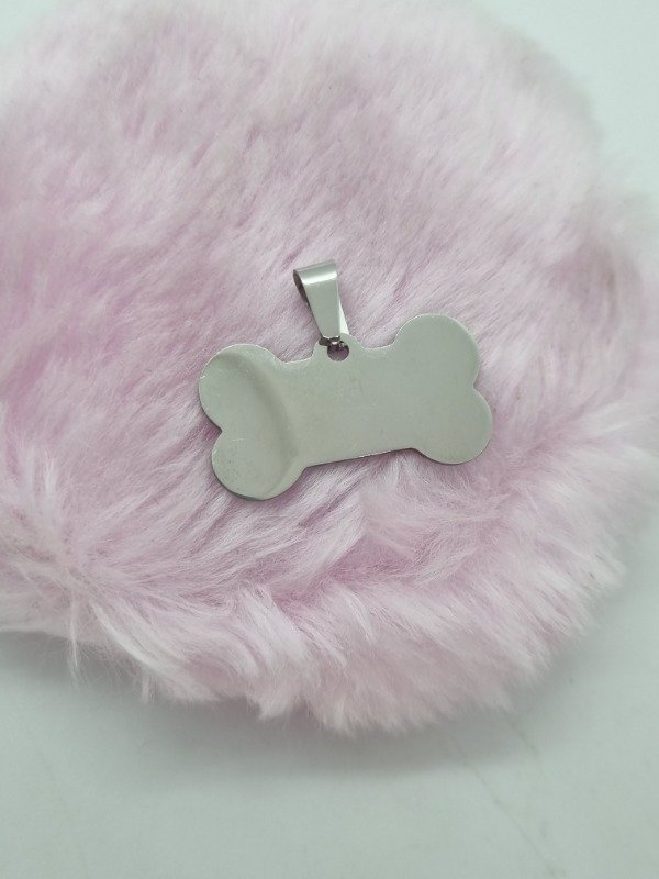 Producto - Dije acero quirurgico chapita hueso