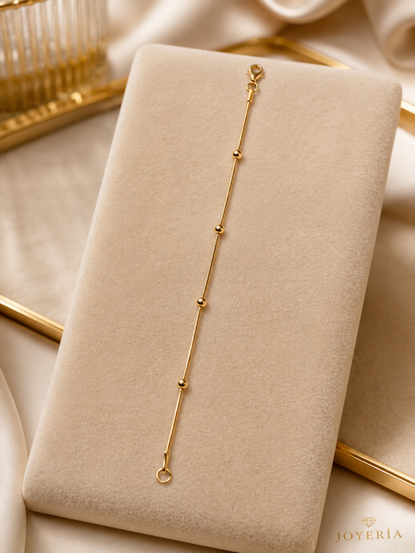 Producto - Pulcera acero dorado pelotitas 18cm