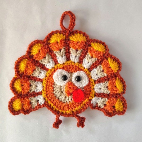 Producto - Agarradera cocina pavo real tejida crochet