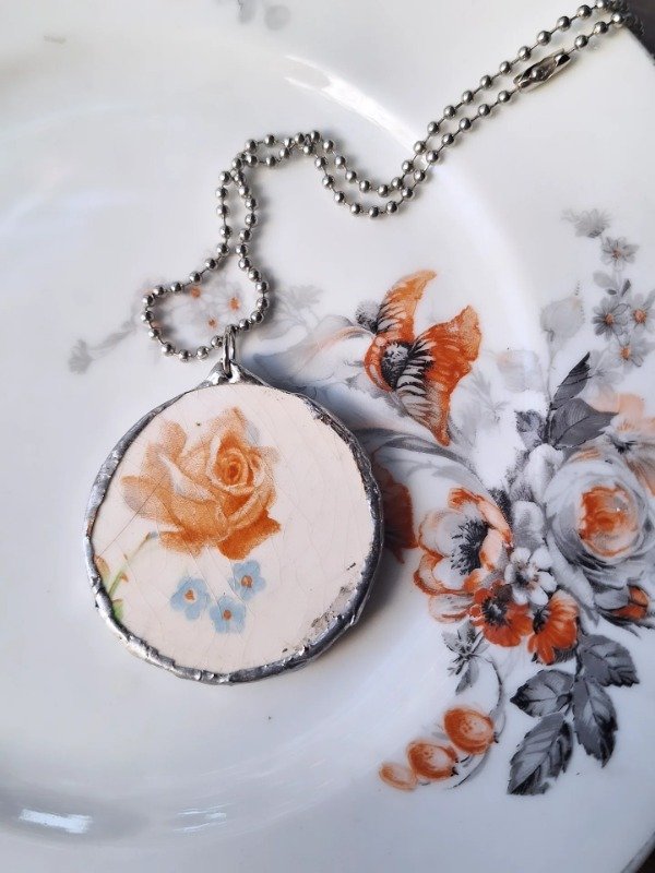Producto - Dije grande flor Sebring U.S.A 2 - 0