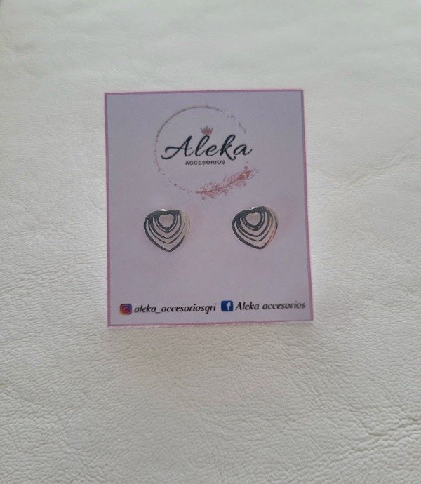 Producto - Aros corazones calados de acero blanco - 1