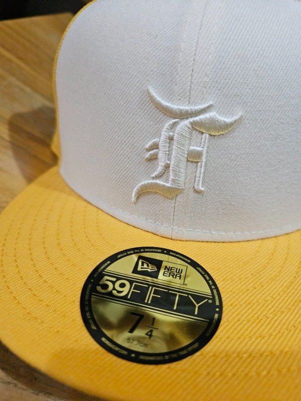 New era fear of god essentials yellow