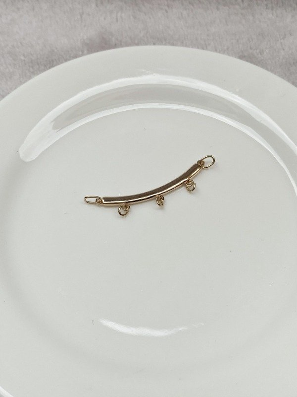 Producto - DIJE DE ACERO DORADO (PERCHA x3)