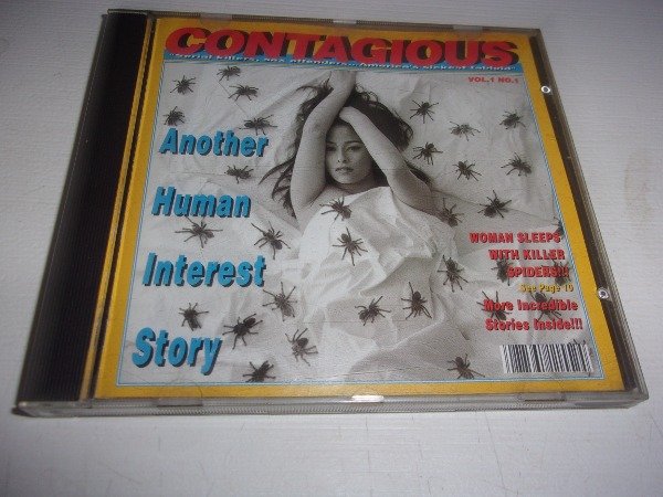 Producto - CD CONTAGIOUS ANOTHER HUMAN INTEREST STORY USA LEER L58