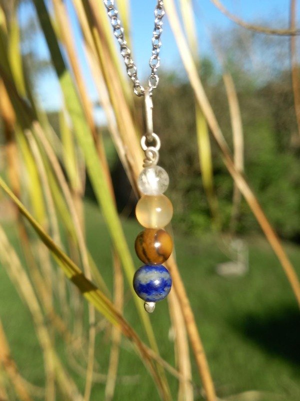Producto - Pendulo de lapislazuli, ojo de tigre, agata cornalina y cuarzo cristal
