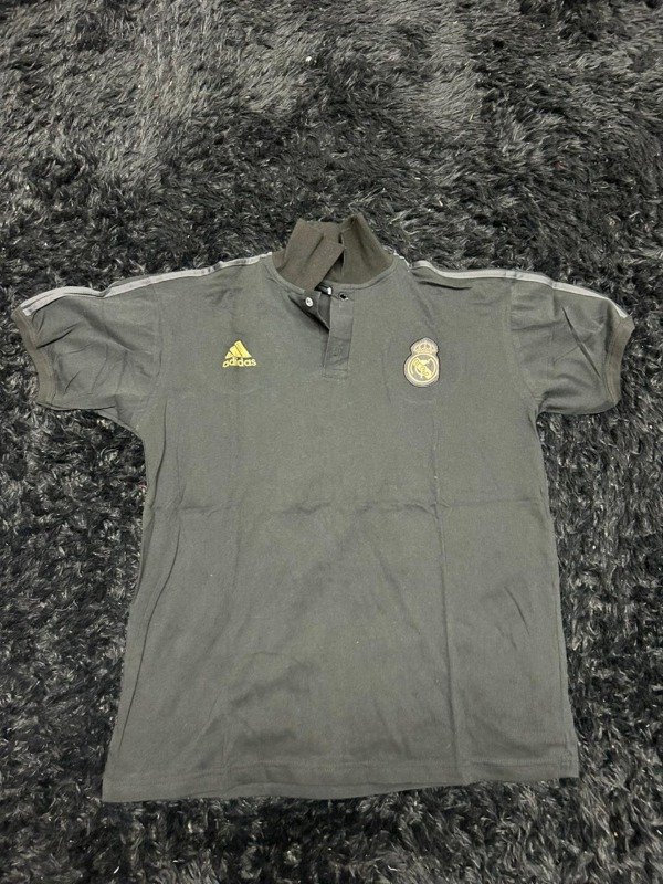 Producto - CHOMBA NEGRA REAL MADRID