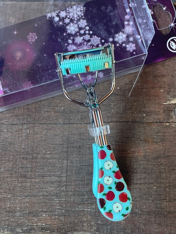 Producto - Arqueador turquesa con separador de pelos , con manzanas