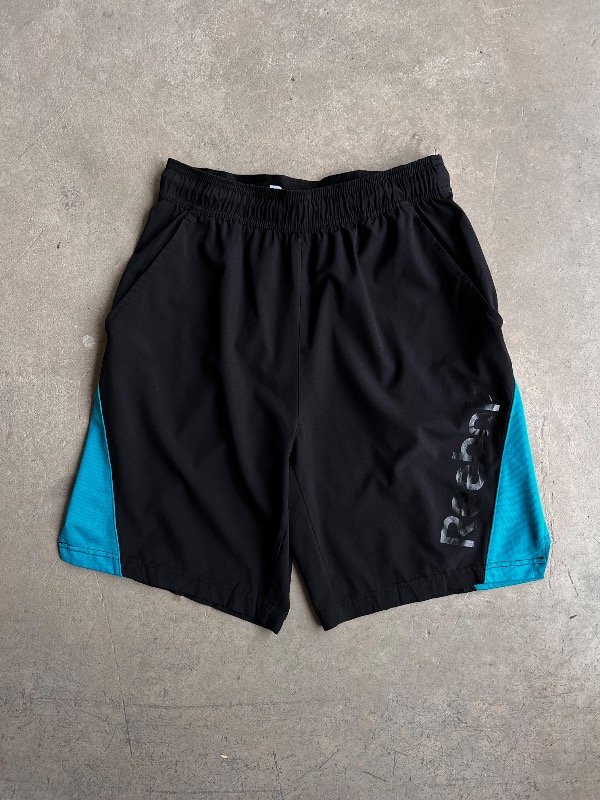 Producto - SHORT TIPO ROMPEVIENTO REEBOK (M)