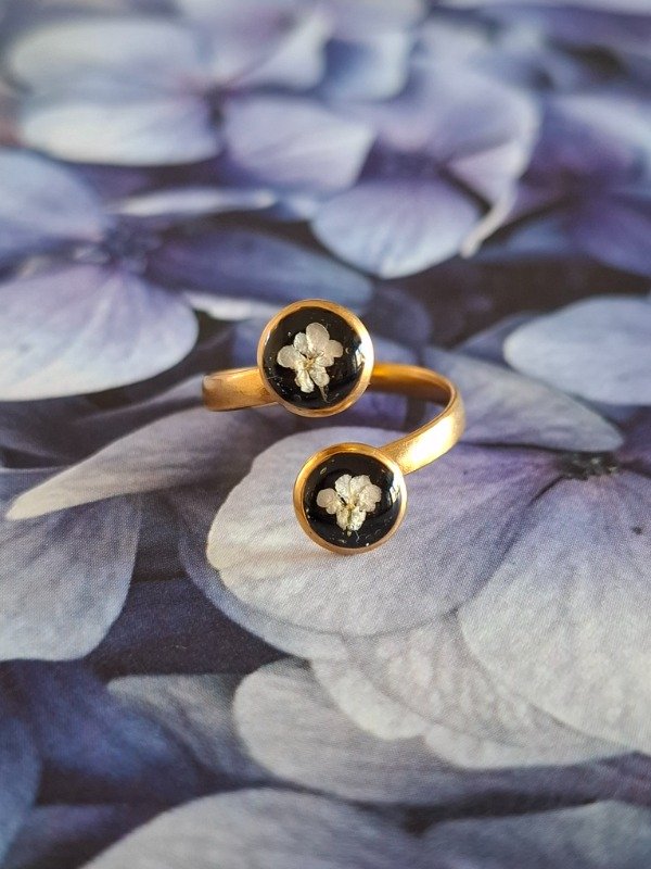 Producto - destellos nocturnos en mano de oro