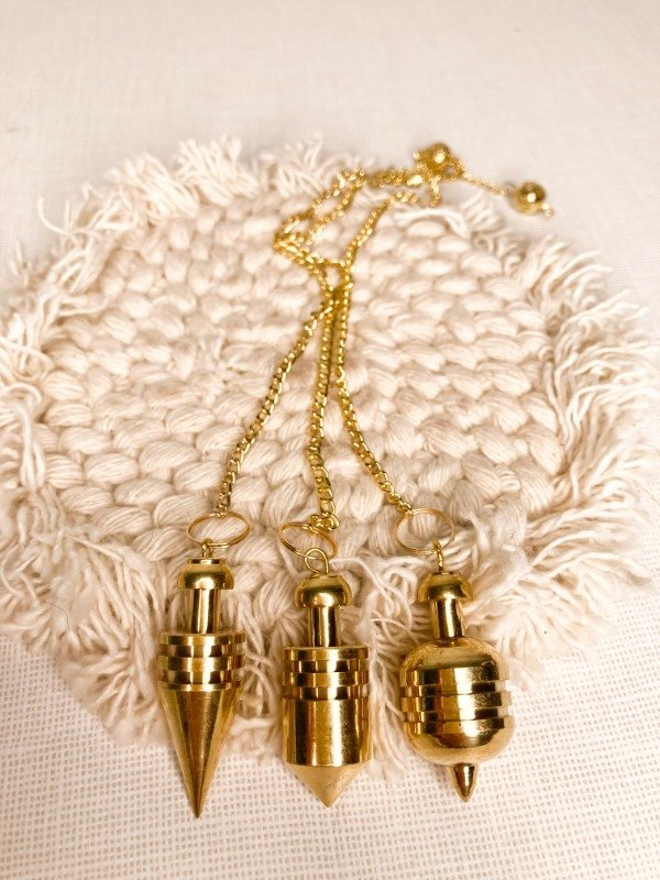 Producto - PÉNDULO DE BRONCE CON TESTIGO
