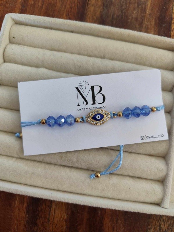 Producto - Pulsera ojitos celeste.
