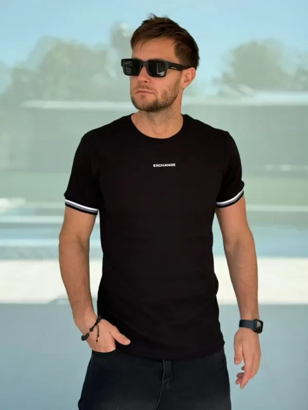 Producto - REMERA EXCHANGE MORLEY negra