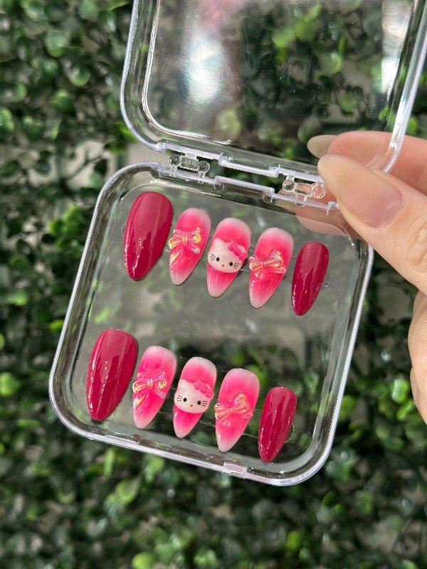 Producto - Uñas Kitty Fucsia Moño