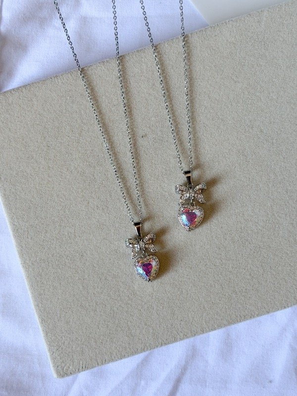 Producto - Collar corazón con moño stras-acero quirúrgico