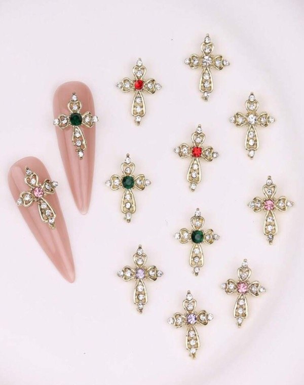 Producto - Dije de uñas cruces doradas strass