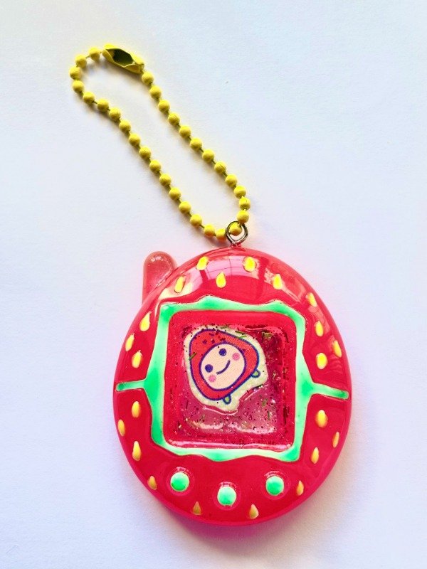 Producto - Tamagotchi shaker frutilla