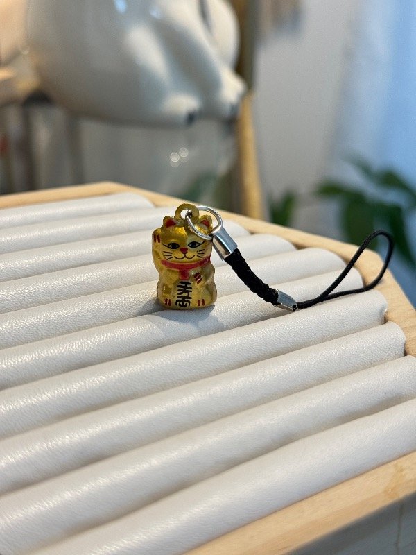 Producto - Cuelga celu gatito dorado