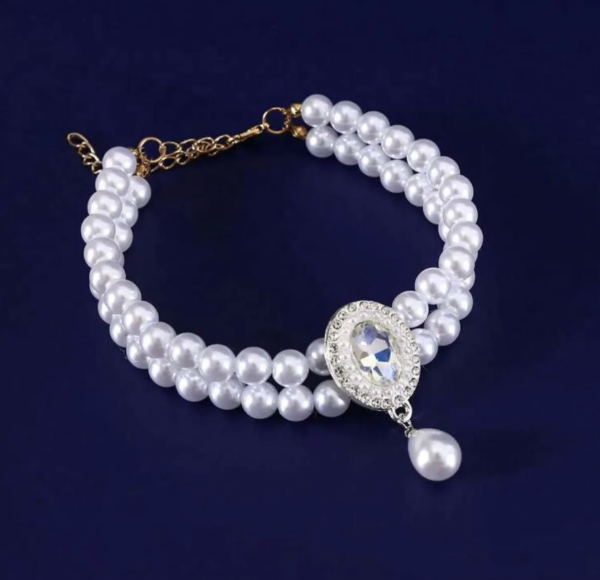 Producto - Collar de doble fila de perlas y dije.