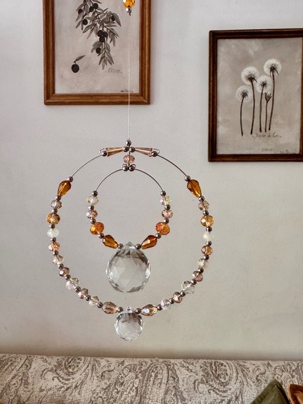 Producto - Atrapasol doble aro, doble esfera color ámbar