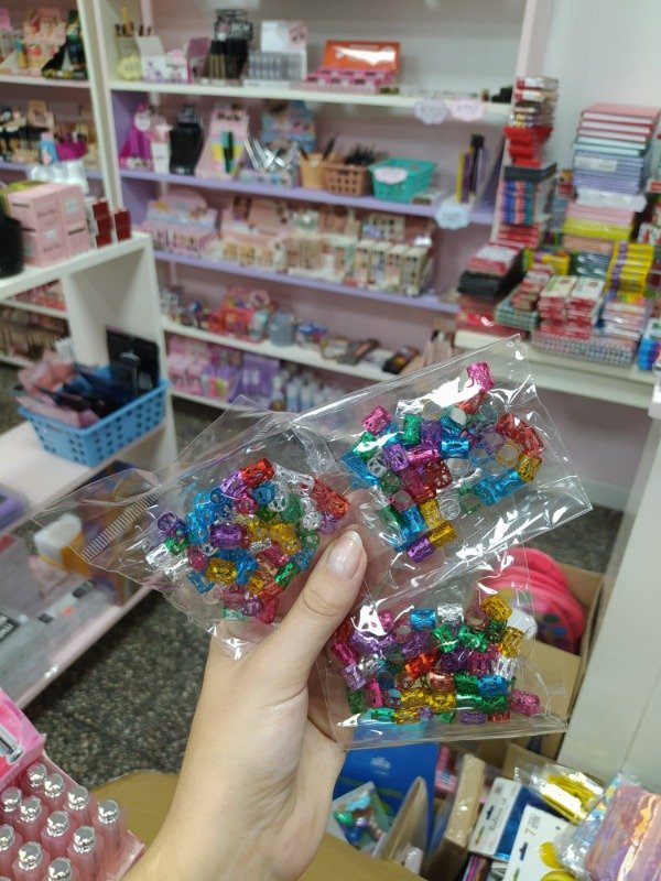 Producto - Bolsita de accesorios para trenza multicolor x50