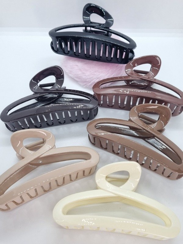 Producto - Broche plástico alargado curva gama marrones