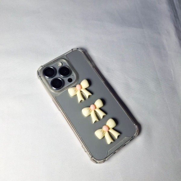 Producto - Charms moños cremas