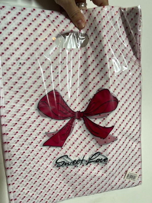Producto - 100 bolsas 25x35 puntitos con moño