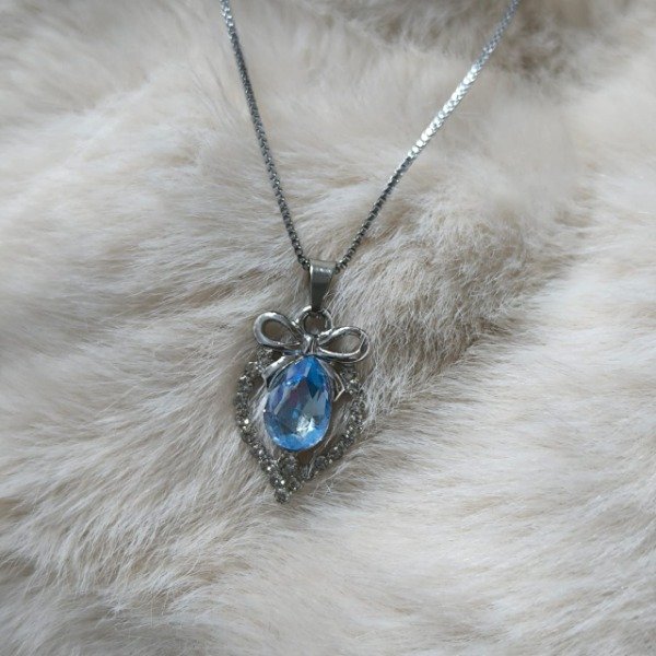Producto - Collar moño corazón brillante plateado - Acero