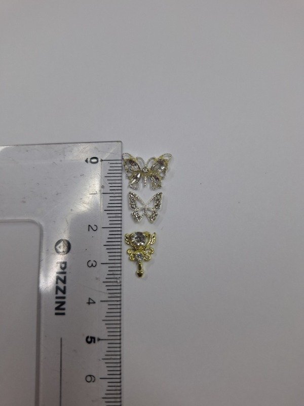 Producto - mini dijes brillantes x3