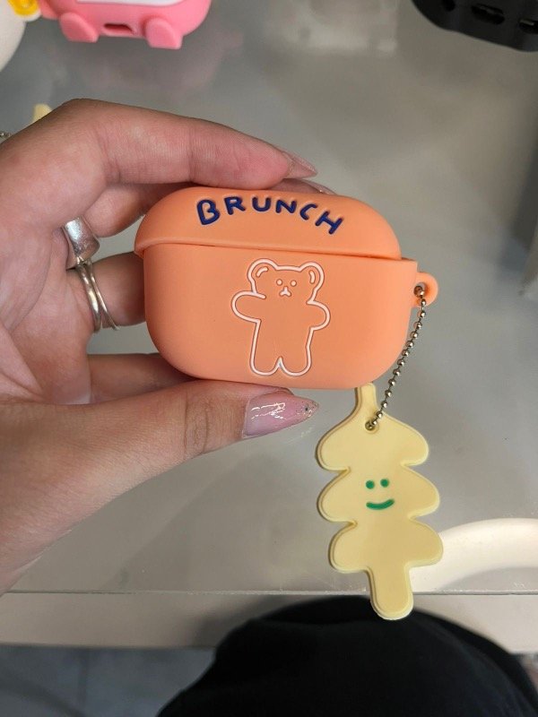 Producto - Funda AirPods osito naranja