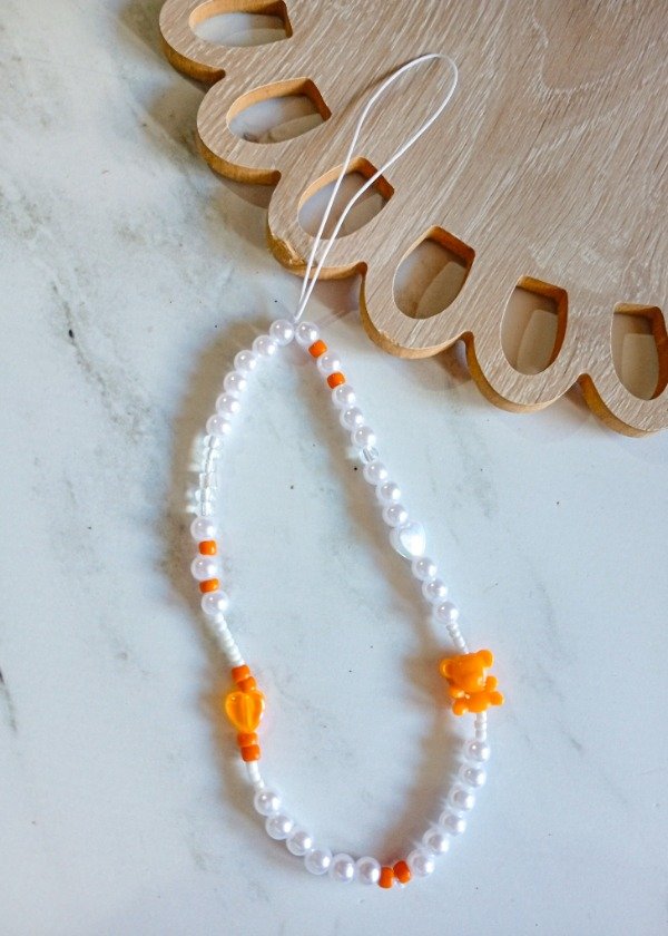 Producto - Strap naranja  perlado