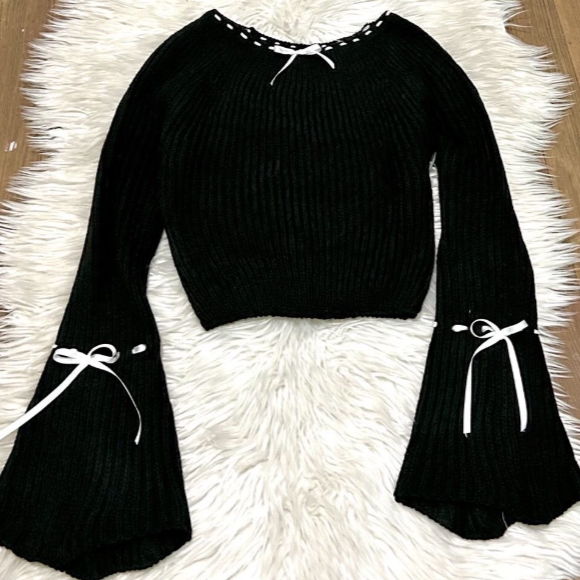 Producto - Sweater con mangas oxford coquette con moño - Negro