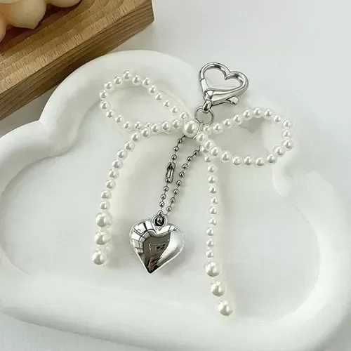 Producto - Llavero perlas 2 tamaños moño corazon plateado