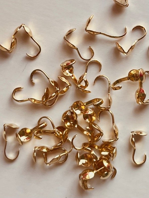 Producto - Tapanudos dorado X50U