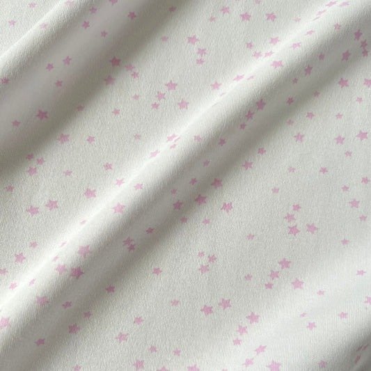 Producto - Interlock Estrellitas rosas xkg